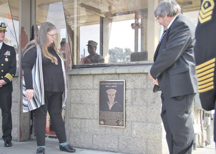 (March 5, 2020) The parents of Steelworker 3rd Class Eric L. Knott cut the ribbon of the newly named Knott Gate. The life and sacrifice of the fallen Seabee were honored at a ceremony where the main gate of Naval Base Ventura County Port Hueneme was renamed Knott Gate. Knott was killed in action by indirect fire, which also wounded three other Seabees on Sept. 4, 2004 while serving with Naval Mobile Construction Battalion 4 in Fallujah, Iraq in support of Operation Iraqi Freedom. U.S. Navy photo by Sarah MacMillan.