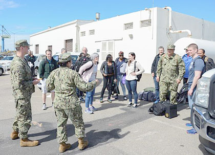 SAN DIEGO (March 22, 2020) Navy reserve component Sailors prepare to embark aboard the Military Sealift Command hospital ship USNS Mercy (T-AH 19) at Naval Base San Diego, March 22, 2020. Mercy is deploying in support of the nation's COVID-19 response efforts and will serve as a referral hospital for non-COVID-19 patients currently admitted to shore-based hospitals. U.S. Navy photo by MC1 Travis S. Alston