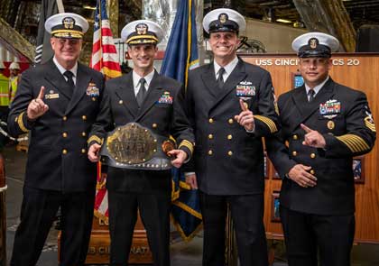 Rear Adm. Brent DeVore, commander, Expeditionary Strike Group 3, left, poses with the leadership of the Independence-variant littoral combat ship USS Cincinnati (LCS 20) after eight-months of sustained operations at sea in the U.S. 3rd and 7th Fleets, March 4, 2026. The Cincinnati returned to its homeport of San Diego after eight months of sustained operations in the U.S. 3rd and 7th Fleet areas of operations. Littoral combat ships are fast, optimally manned, mission-tailored surface combatants that operate in near-shore and open-ocean environments, winning against 21st-century threats. LCSs integrate with joint, combined, manned, and unmanned teams to support forward presence, maritime security, sea control, and deterrence missions around the globe. U.S. Navy photo by MC1 Brandon Roberson.